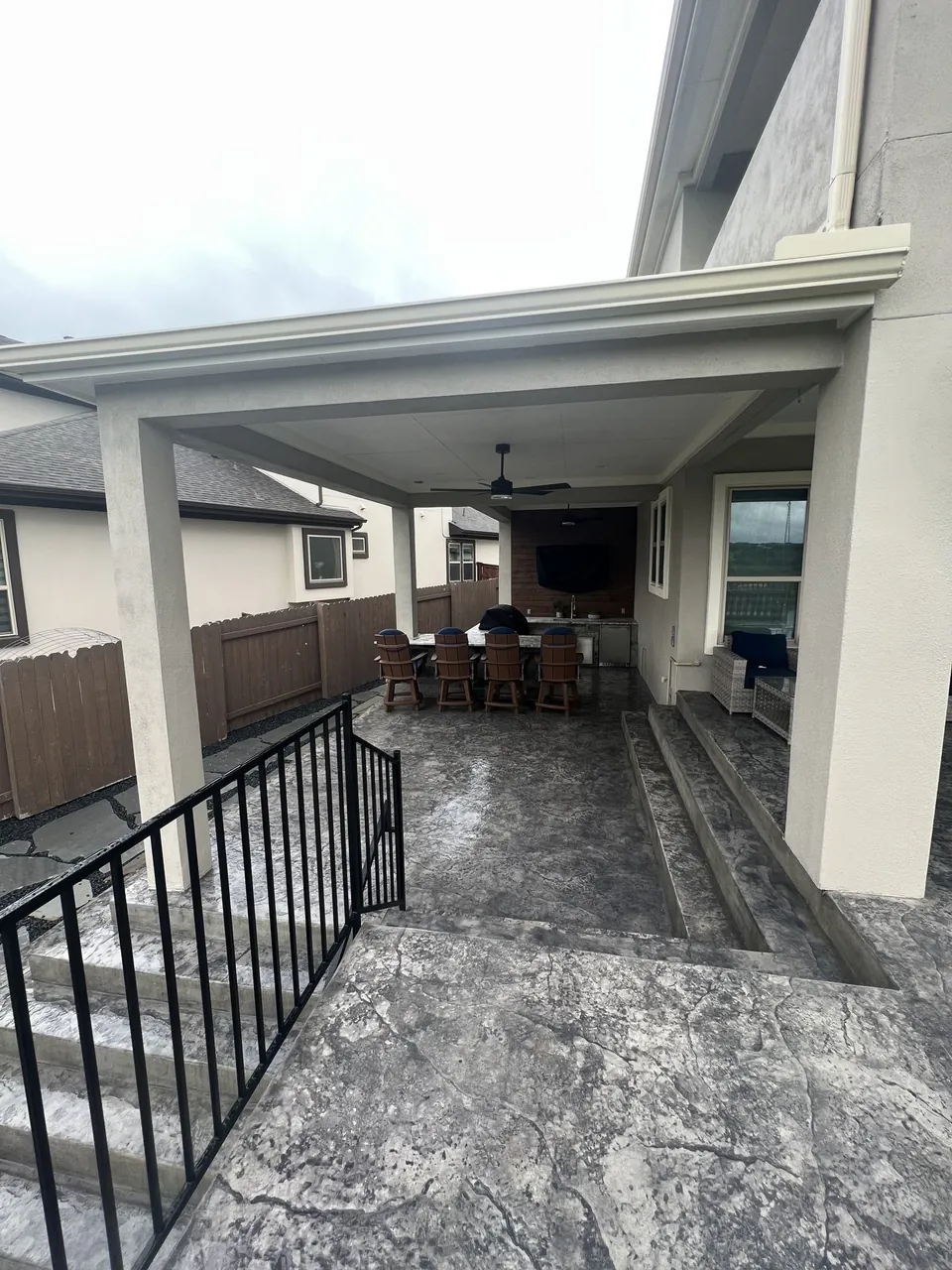 Attached patio cover showing the roof and wall tie-in to the existing home