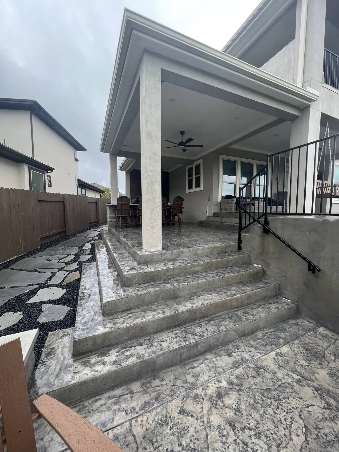 Attached patio cover with its roofline integrated into the existing home