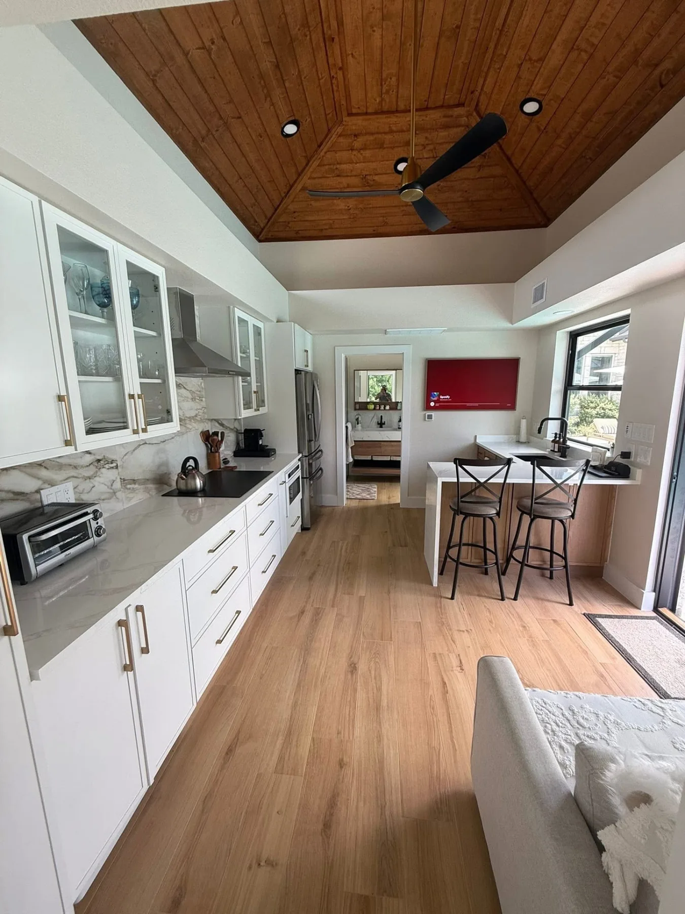 Finished interior of a detached structure with clean wall surfaces and usable floor area