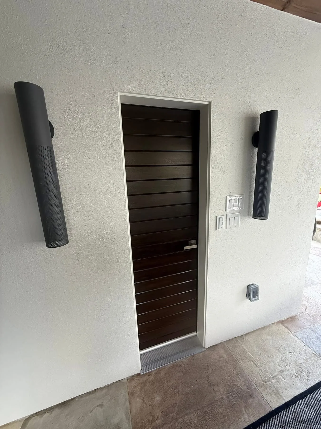 Covered entry and exterior detailing on a detached structure