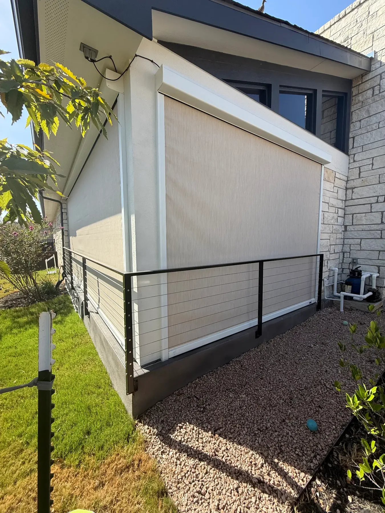 MagnaTrack retractable screen lowered along a covered patio opening