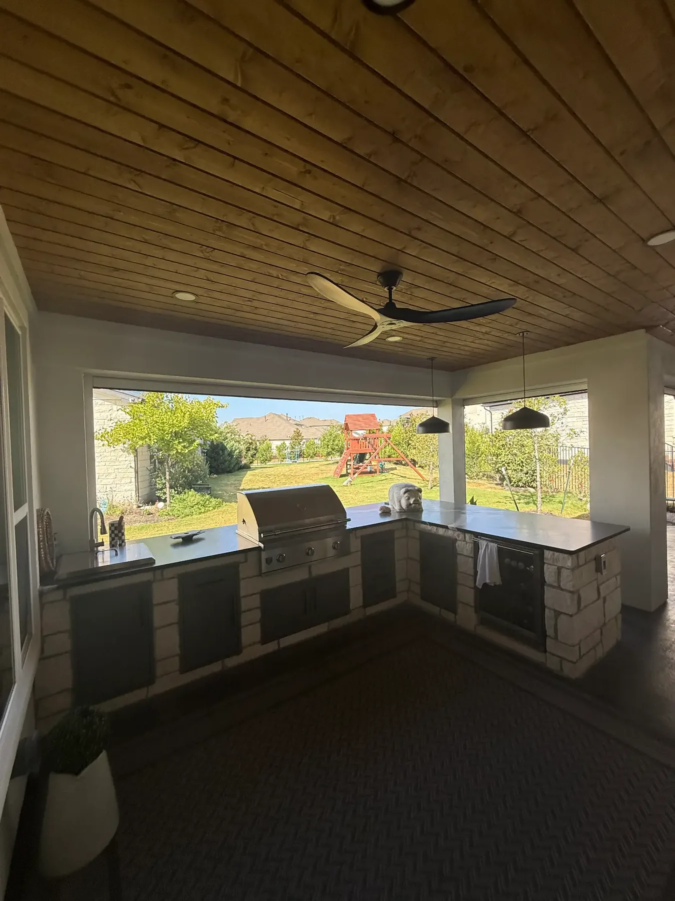 Built-in outdoor kitchen and counter within a custom TWT structure