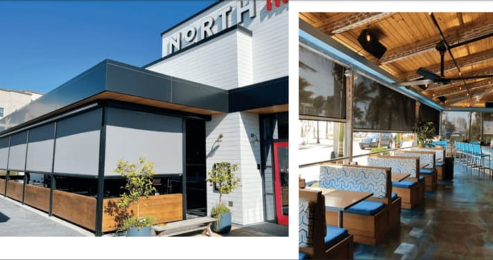Commercial building in Austin, TX, featuring MagnaTrack screens enclosing outdoor dining areas